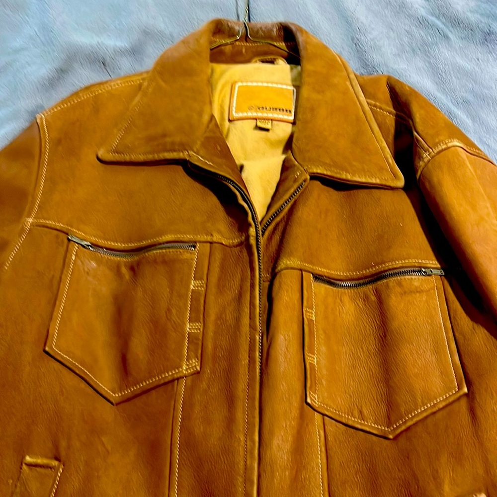 It is a vintage Guess suede jacket rare item